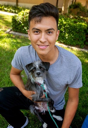 Man holding small dog